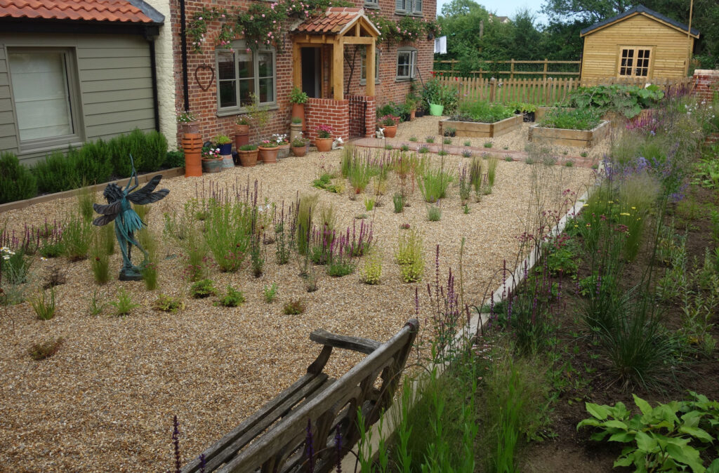 A recent gravel planting and border design requested by clients for a front garden shown shortly after planting