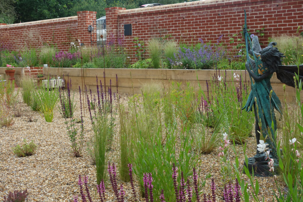 part of the same garden shortly after I had designed a planting plan, sourced and placed plants for the client to put in